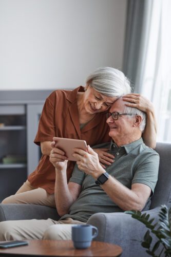 happy couple taking reverse mortgage solution